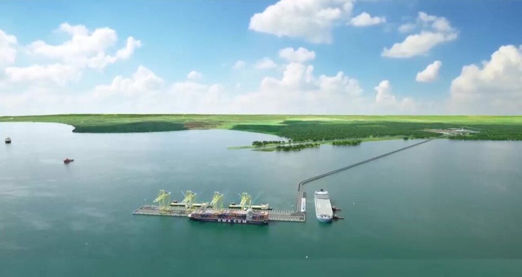 Aerial view of an offshore port with yellow gantry cranes on floating platforms and a docked cargo ship connected by a pier.