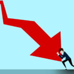 Man in a suit struggles to push a large red arrow that points downward, set against a blue background.
